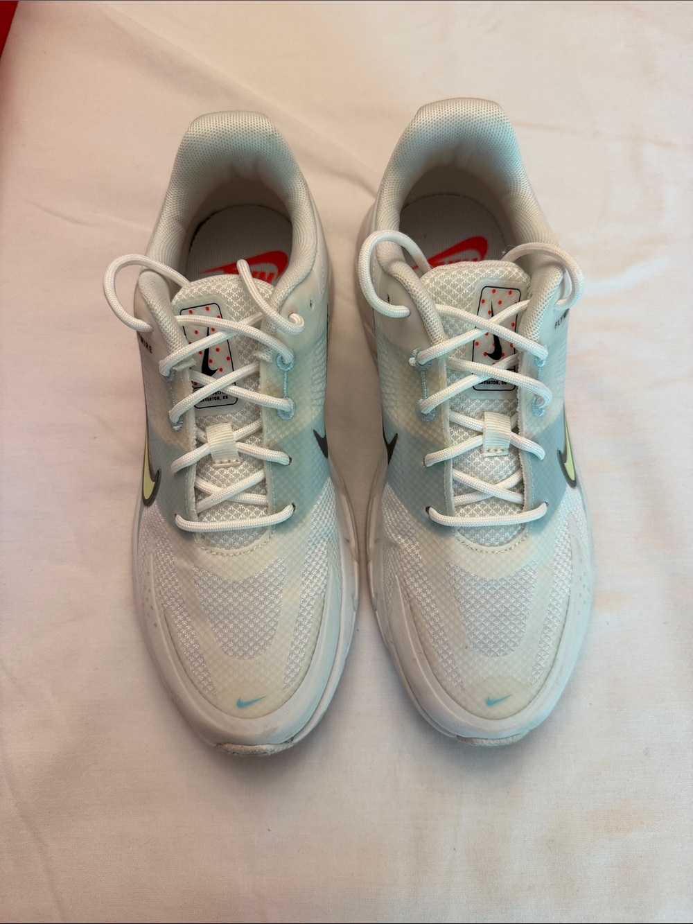 Nike Women's White Athletic Shoes with Black and Neon Green Swoosh